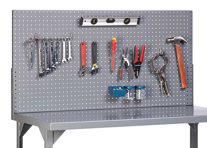 Steel pegboard with a variety of tools